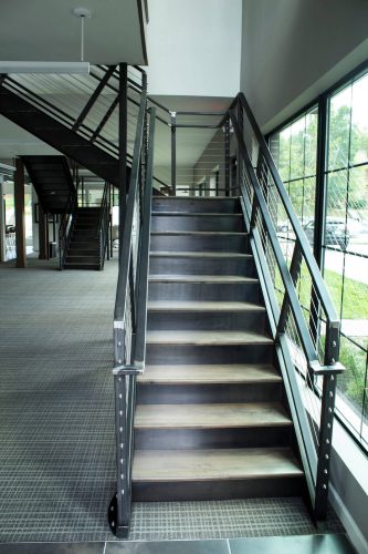 View up staircase with iron railings